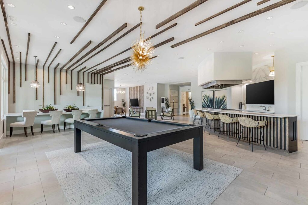 Clubhouse lounge with billiards table and demonstration kitchen