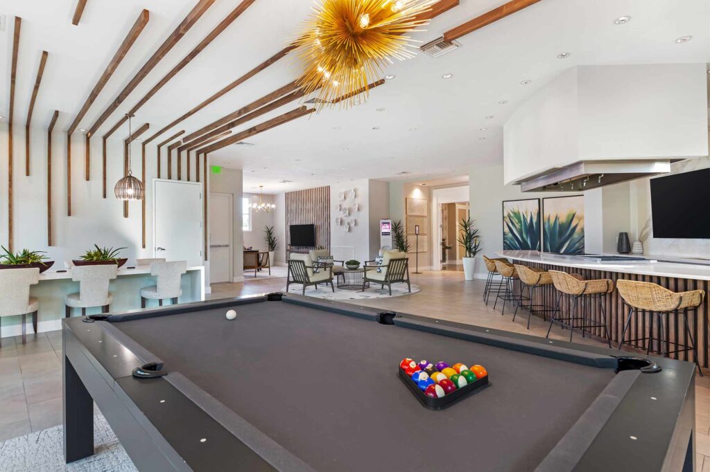Clubhouse lounge with billiards table and demonstration kitchen