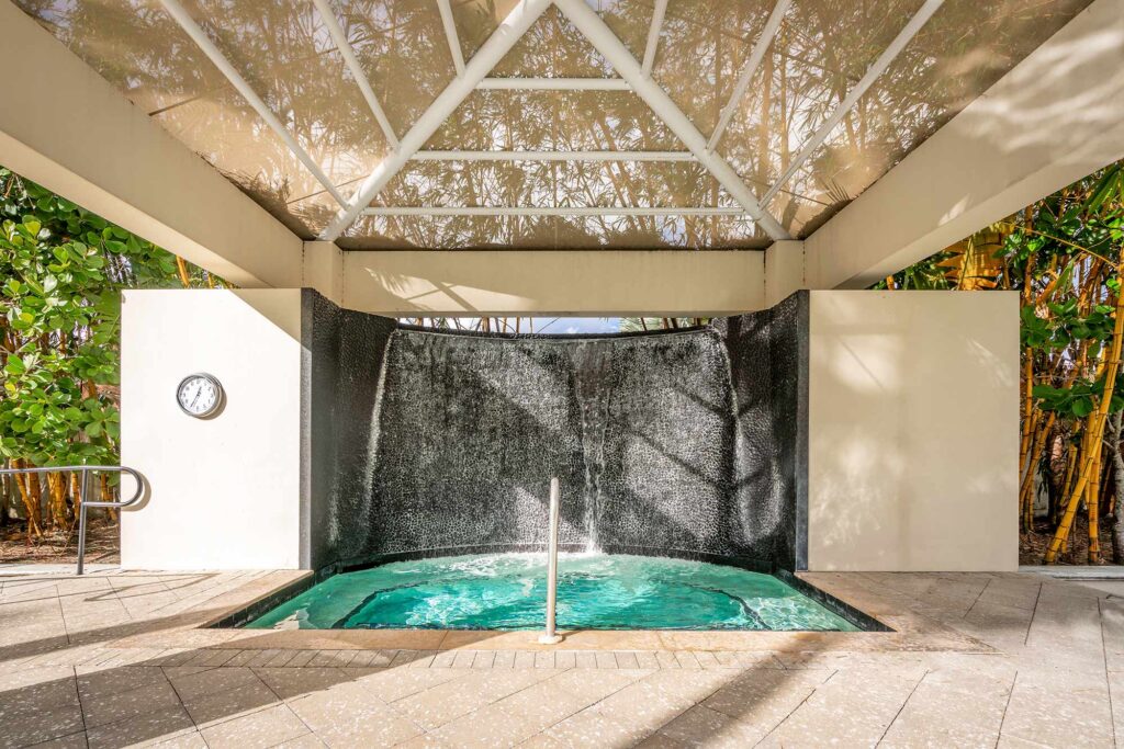 Outdoor covered hot tub by the pool