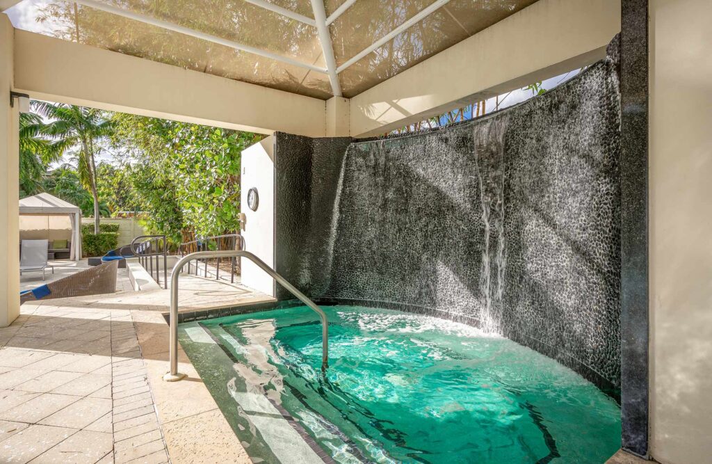 Outdoor covered hot tub by the pool